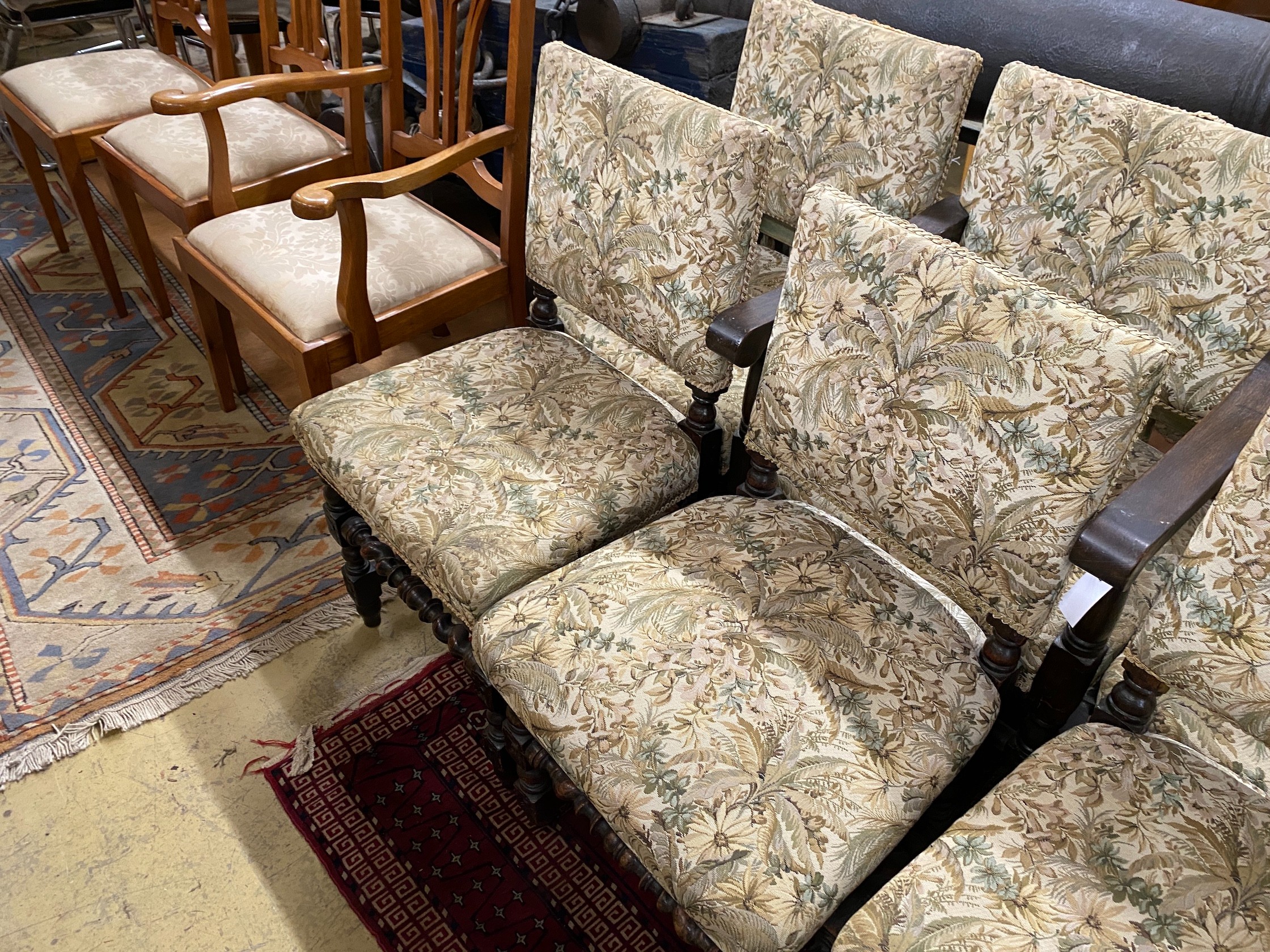 A set of seven 18th century style oak dining chairs, two with arms